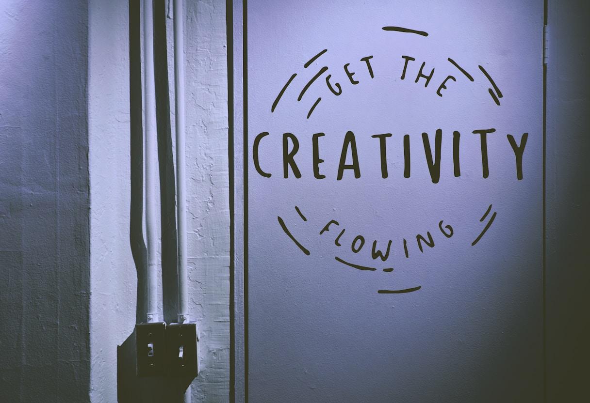 Creative marketing professionals using AI tools for content generation, visual design and campaign scaling