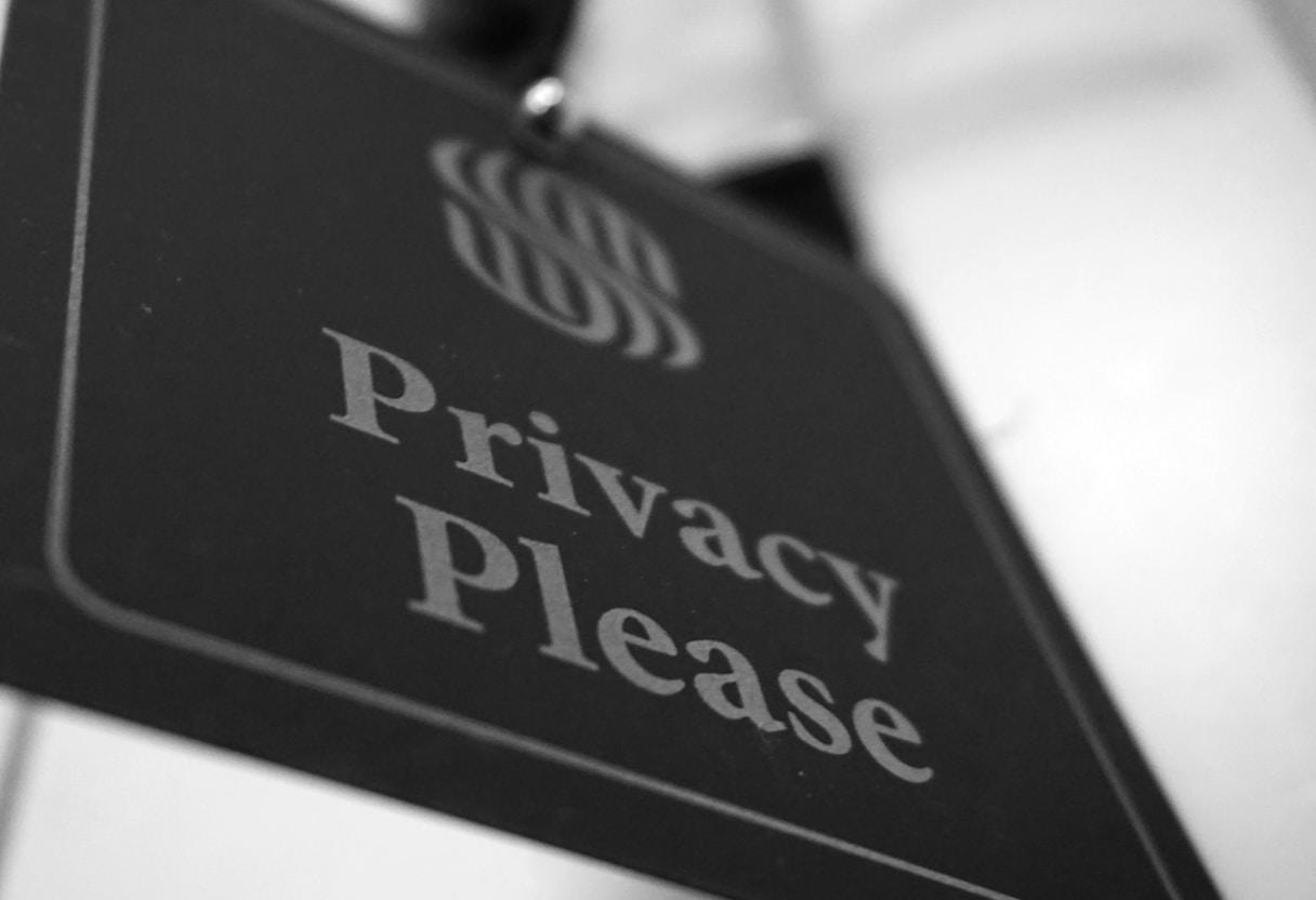 Business team discussing AI marketing ethics, privacy, and compliance standards in a corporate boardroom